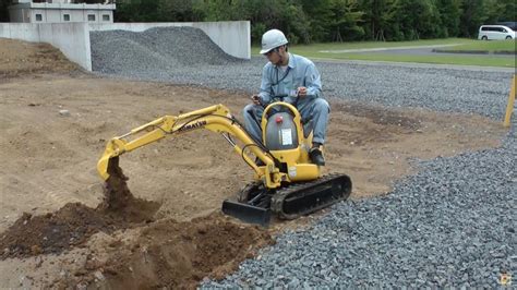 world's smallest excavator|stand behind mini excavator.